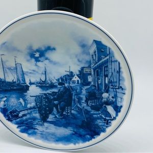 Delft Blue Dutch Plate With a Man Repairing a Fishing Net